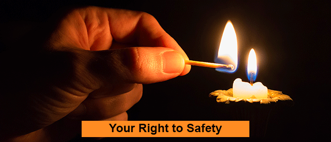 person lighting a candle