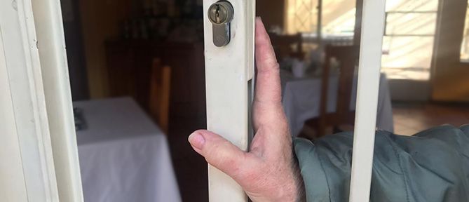 man closing security gate